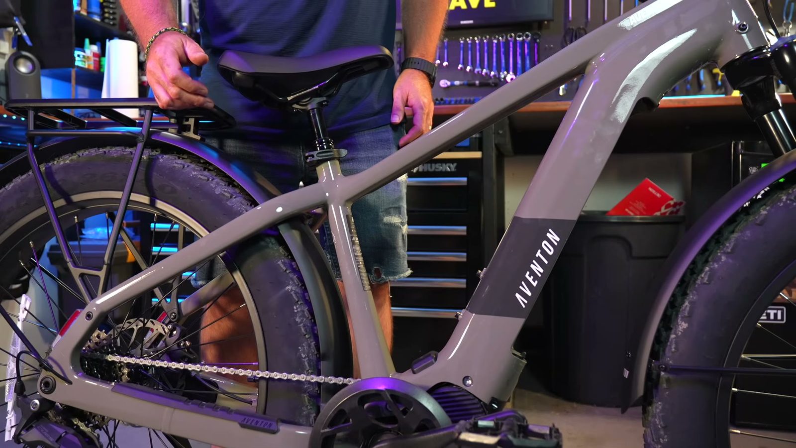 Pressing down on the suspension seat post to demo its travel