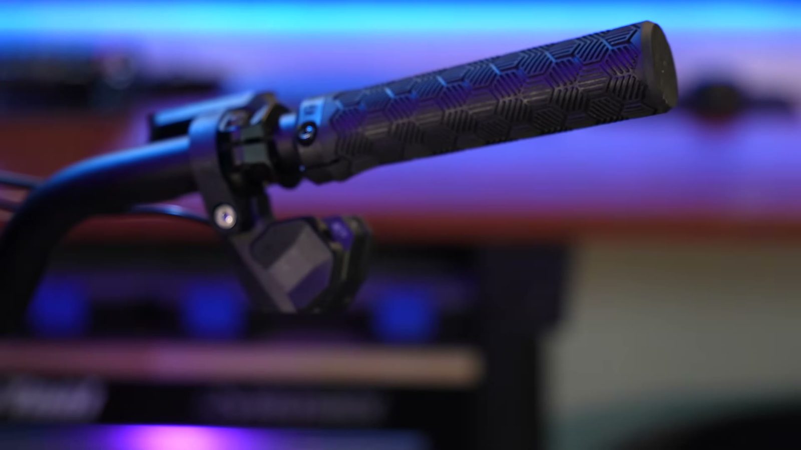 Detail shot of the electronic shifter paddle on the right grip