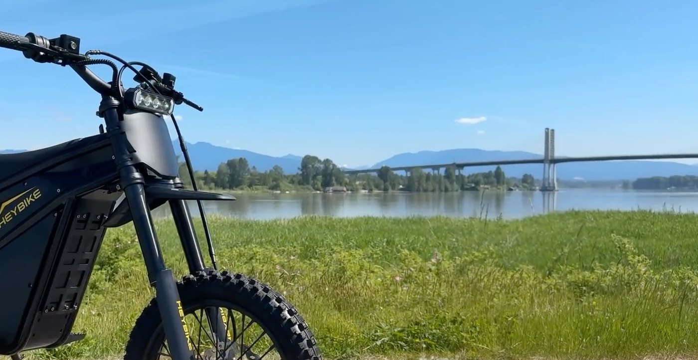 Heybike Villain Midnight Black parked beside the Fraser River