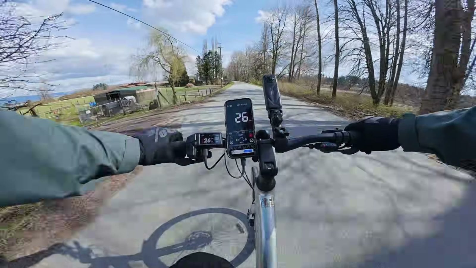 Tempo display reading 26 mph mid top-speed run on an open country road