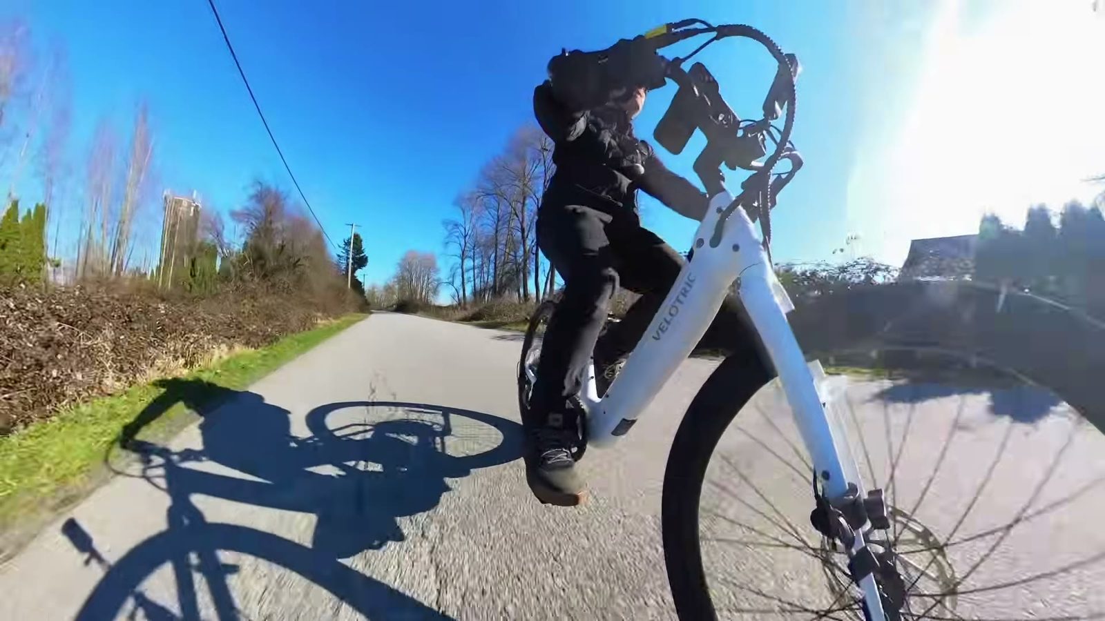 Low angle of the white Breeze 1 mid-ride, frame and fork filling the shot