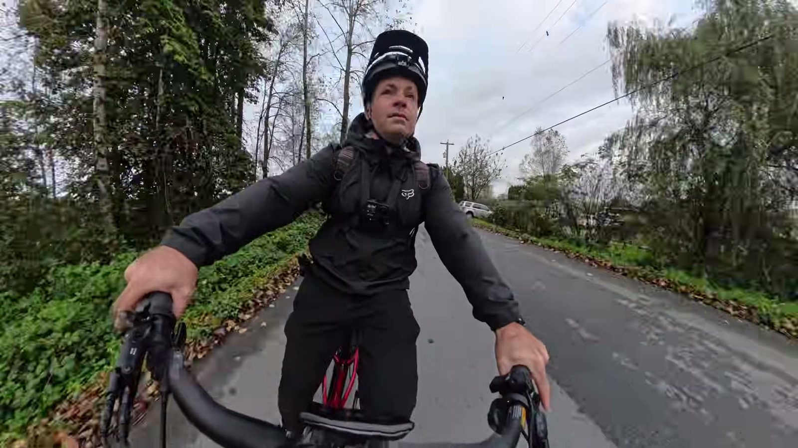 Ben cornering the Discover 2 on a tree-lined road