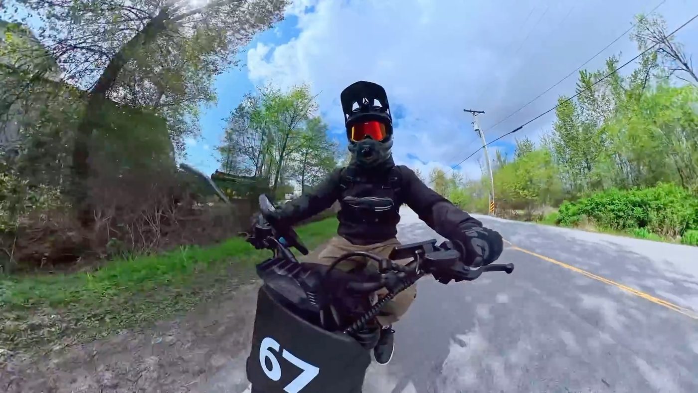 Chest-cam view riding the Yozma IN 10 Pro on open road