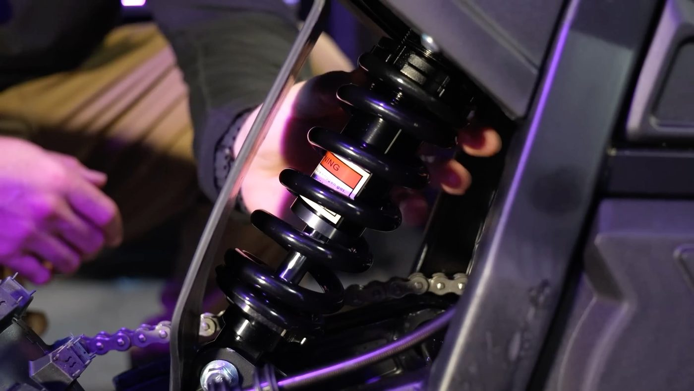 Rear shock with a thicker coil spring